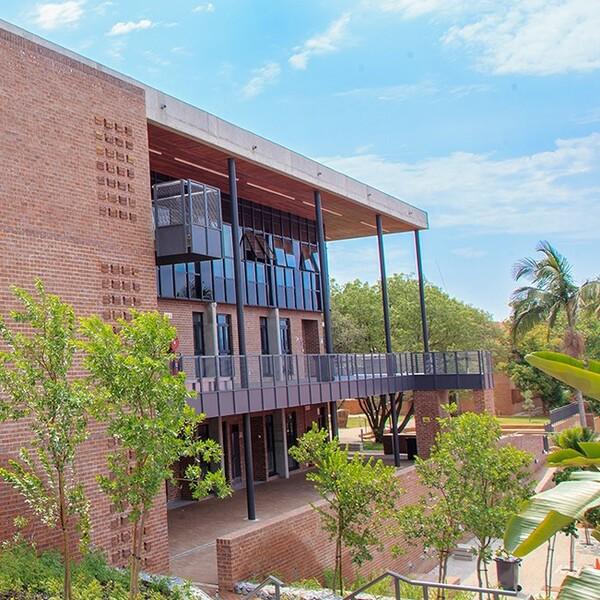 Modern brick commercial building with landscaped surroundings